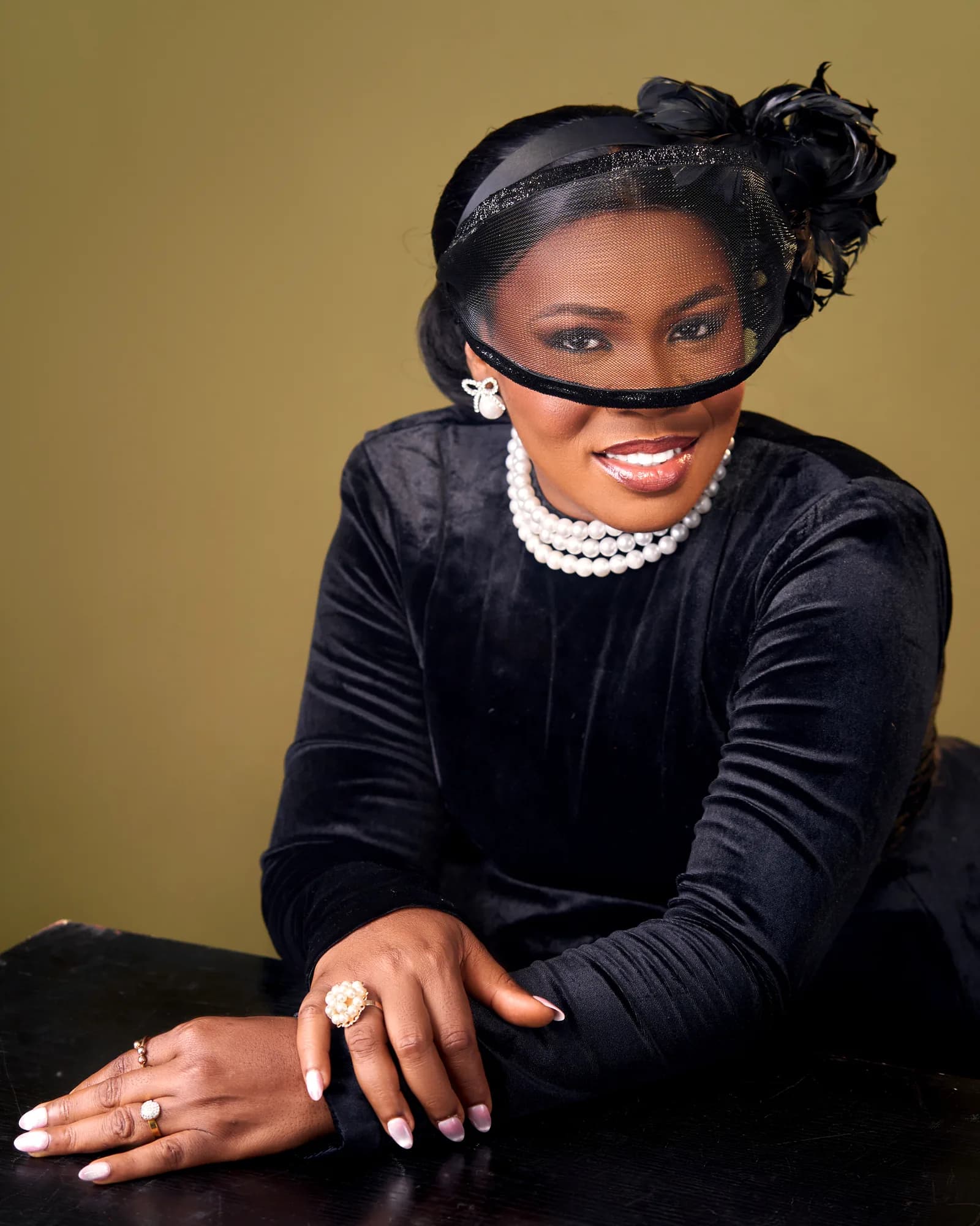 Ebahi seated in an editorial portrait