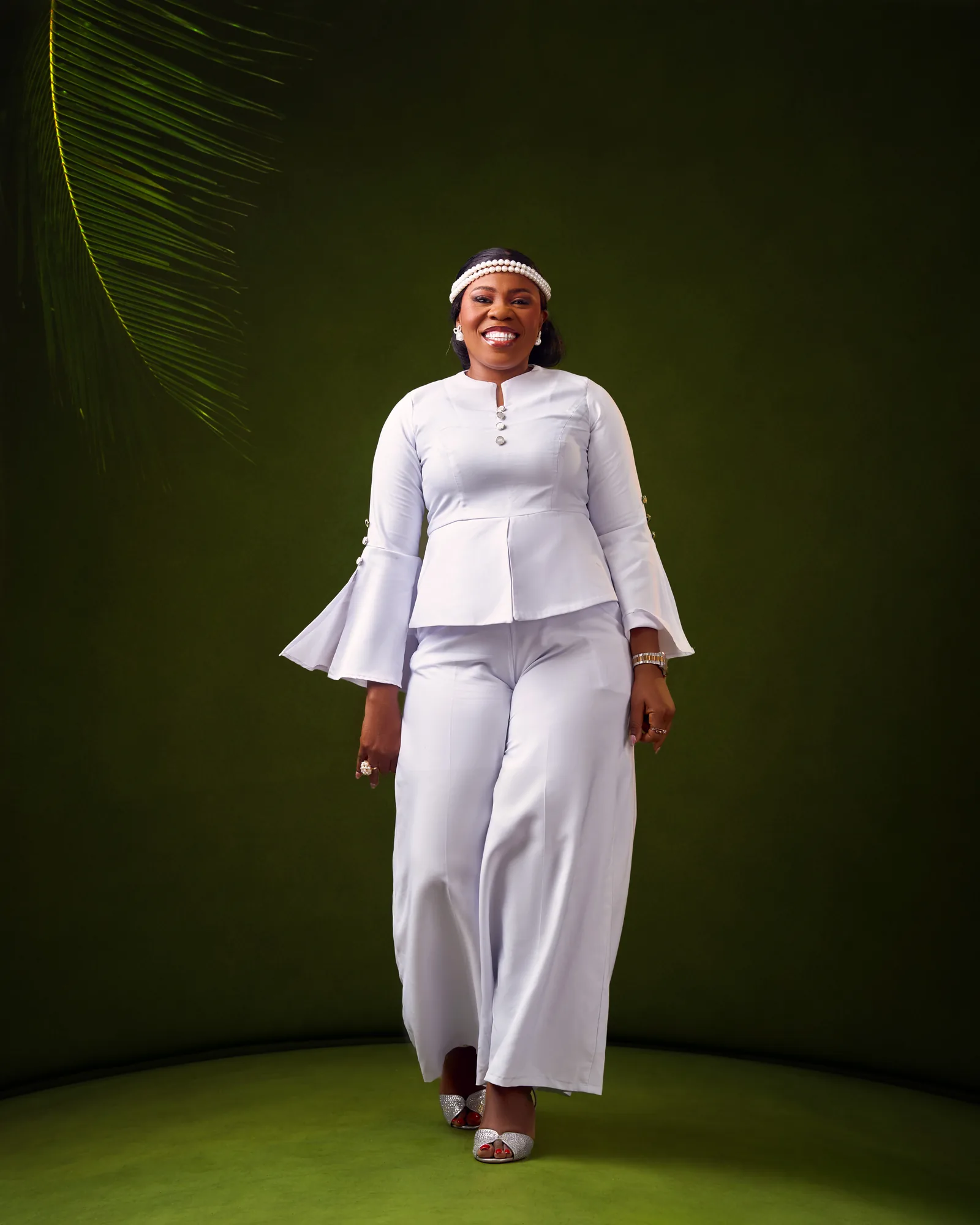Ebahi standing in white